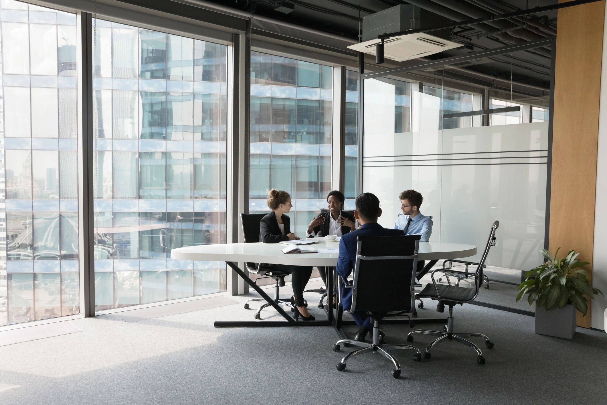 Professional team discussing a project in a modern office